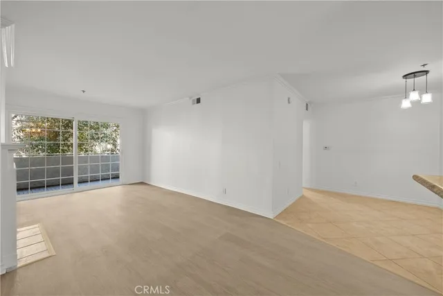 a view of empty room with windows