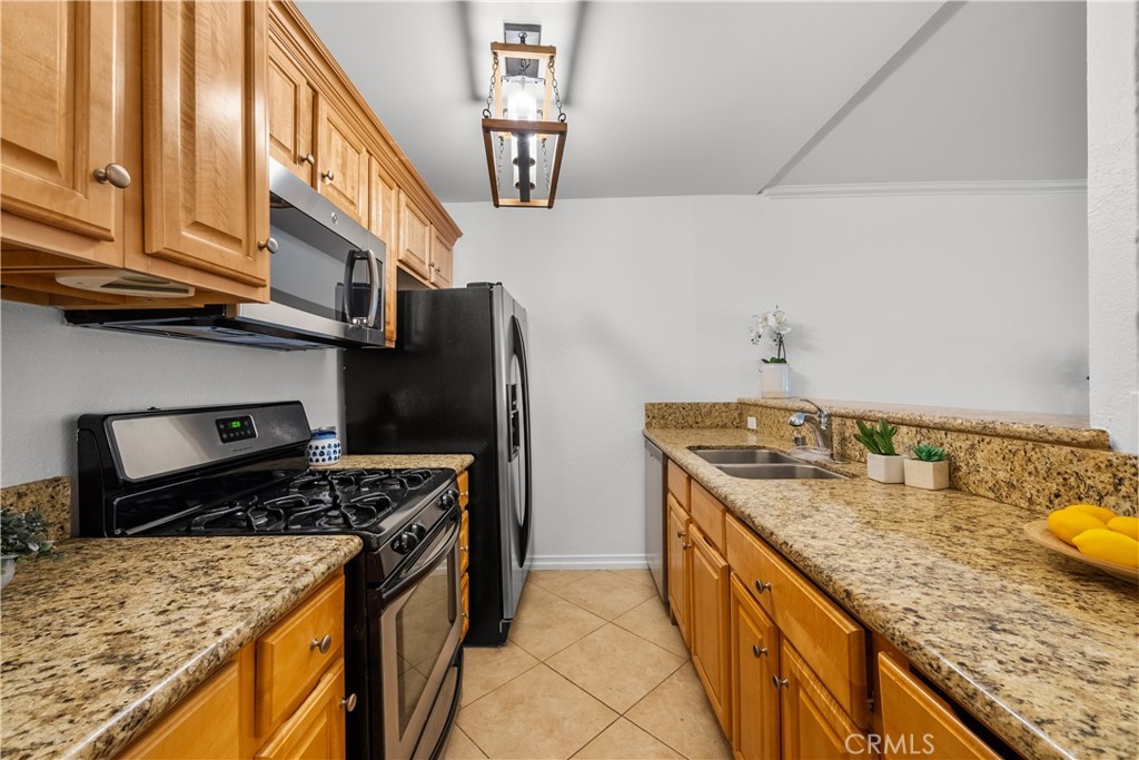 4401 Sepulveda Boulevard, Unit 107 Sherman Oaks, CA 91403 - Photo 9 of 25 a kitchen with a stove and a kitchen