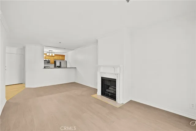 a view of empty room with a fireplace