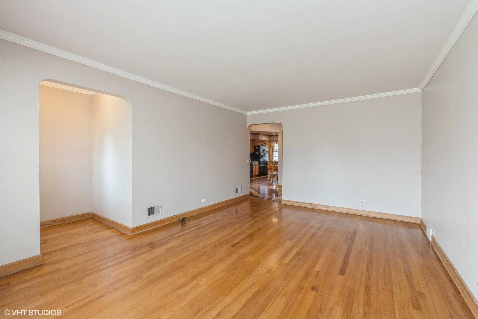 2426 Lathrop Avenue North Riverside, IL 60546 - Photo 2 of 12 an empty room with wooden floor and windows