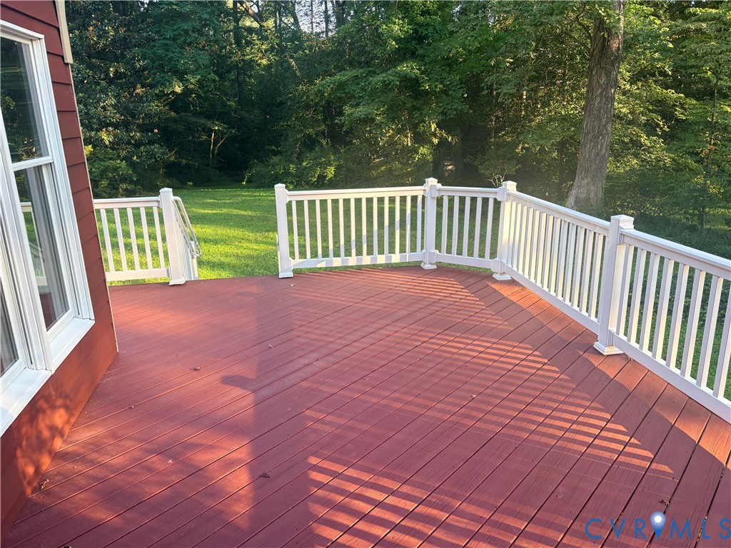 8707 Brown Summit Road North Chesterfield, VA 23235 - Photo 4 of 5 Expansive outdoor deck featuring a rich red stain,