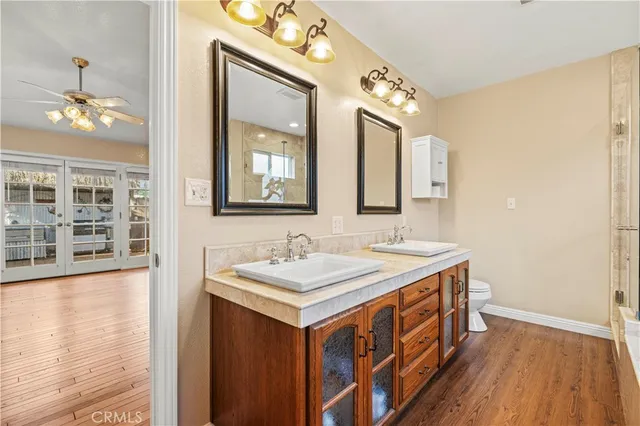 a bathroom with a sink a vanity and a mirror