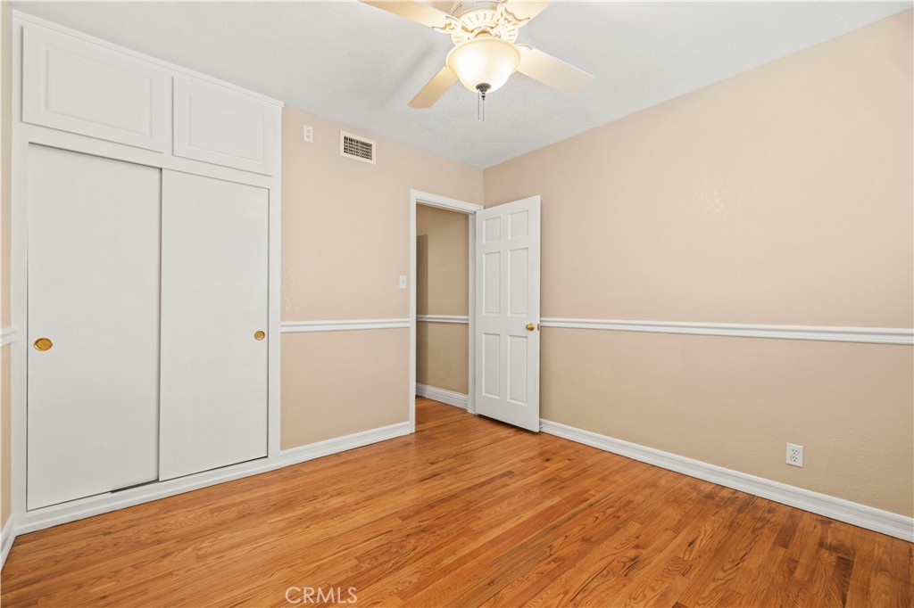 24123 Wildwood Canyon Road Newhall, CA 91321 - Photo 16 of 32 a view of an empty room with wooden floor