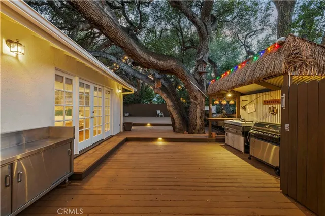 a view of a living room with a large tree