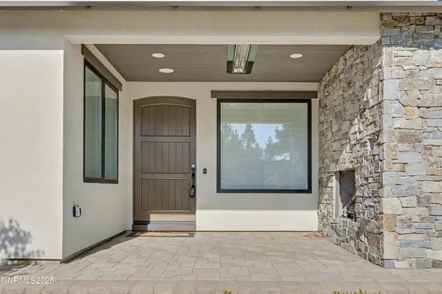 a view of a hallway with wooden door