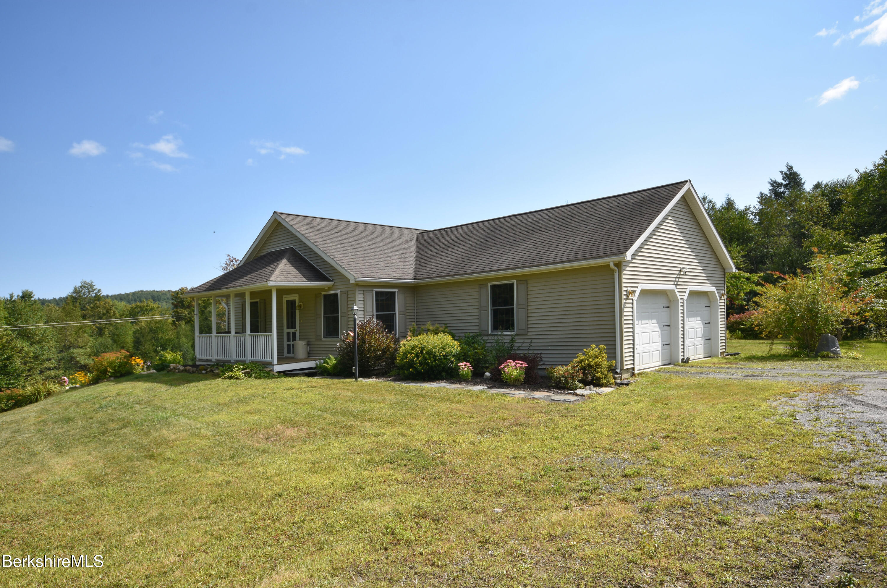 1540 East Windsor Road Windsor, MA 01270 - Photo 1 of 52 a front view of a house with yard and green space