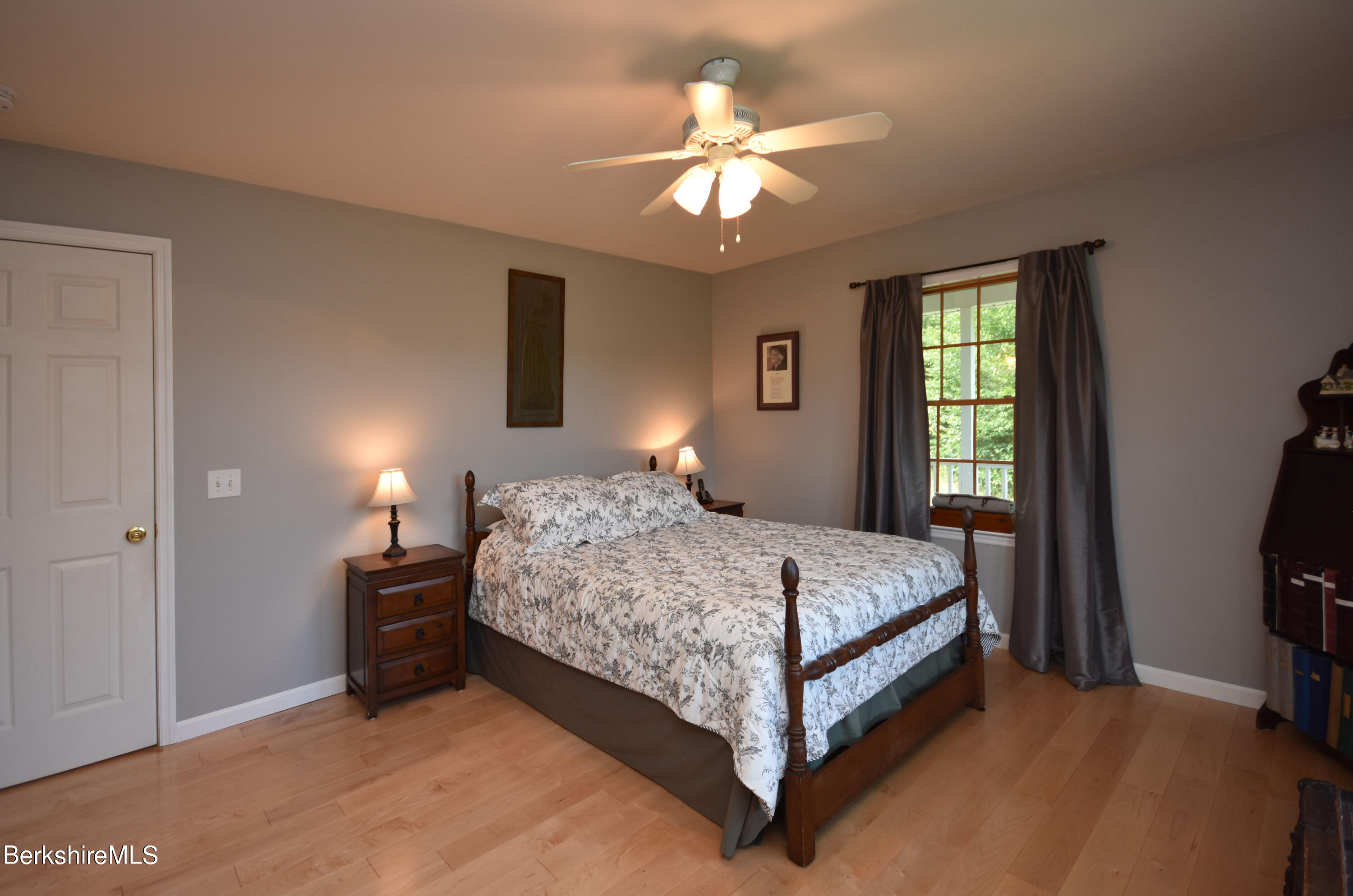 1540 East Windsor Road Windsor, MA 01270 - Photo 17 of 52 a bedroom with a bed and a chandelier