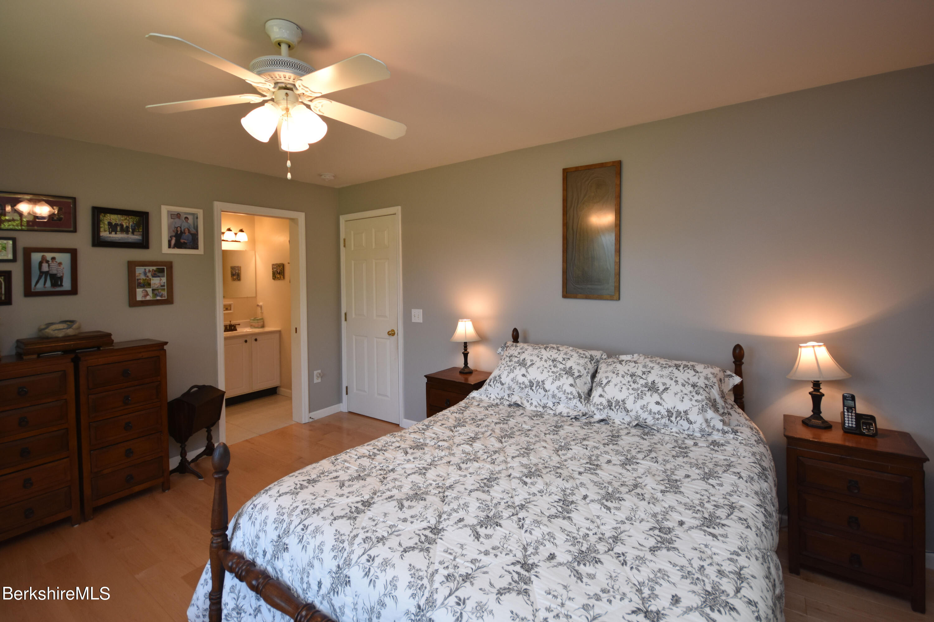 1540 East Windsor Road Windsor, MA 01270 - Photo 19 of 52 a bedroom with a bed and a chandelier