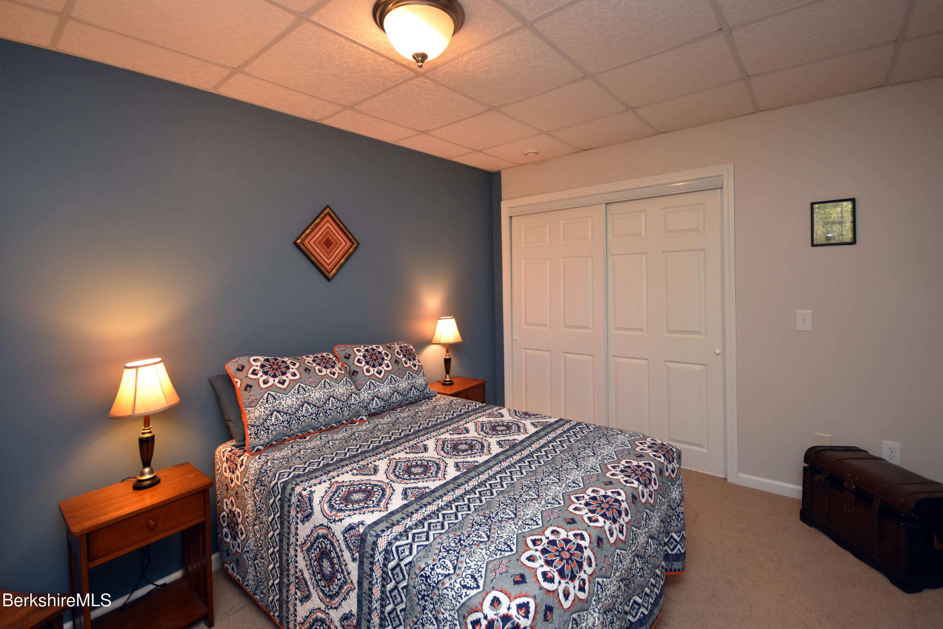 1540 East Windsor Road Windsor, MA 01270 - Photo 27 of 52 a bedroom with a bed and a lamp