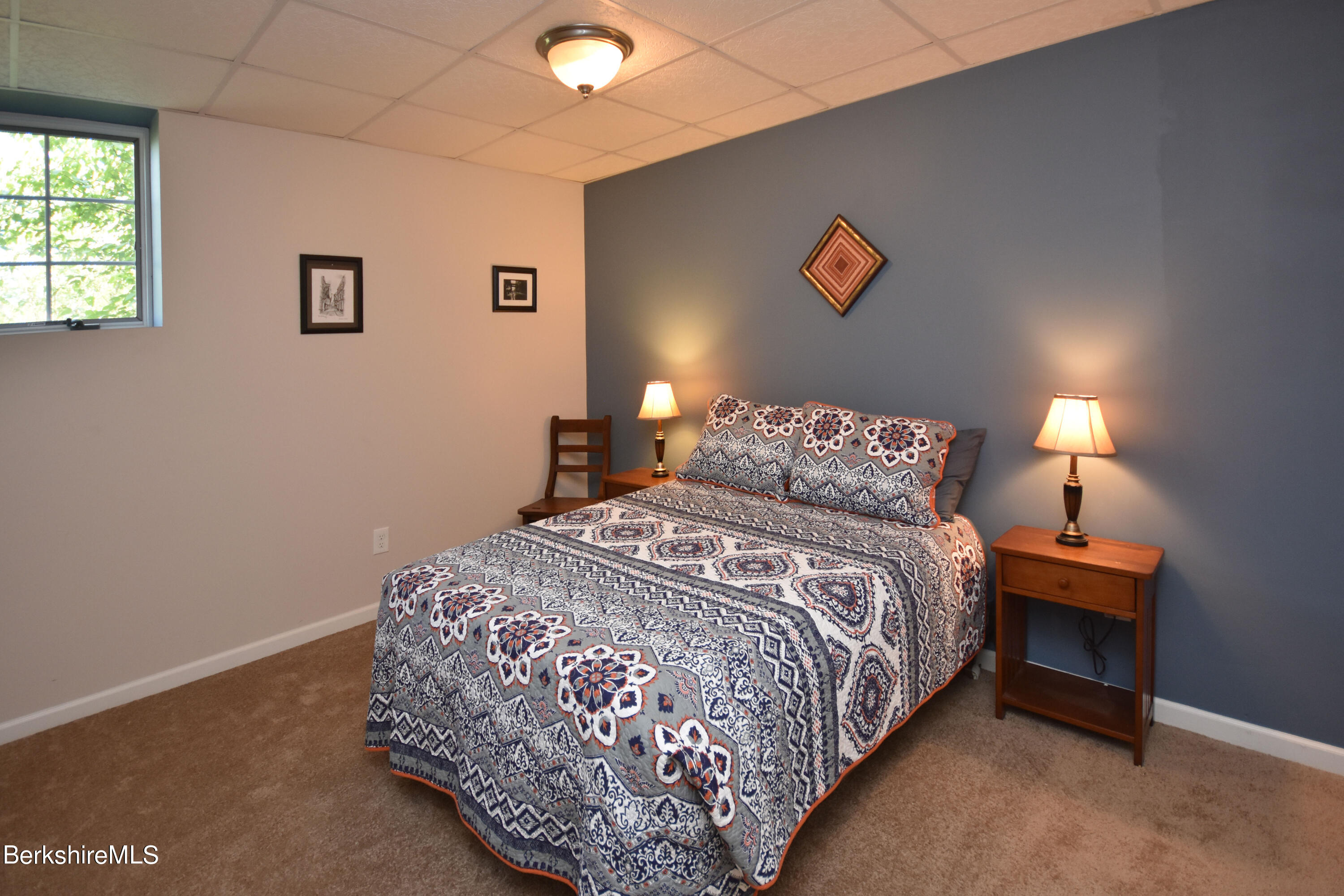 1540 East Windsor Road Windsor, MA 01270 - Photo 28 of 52 a bedroom with a bed and a lamp