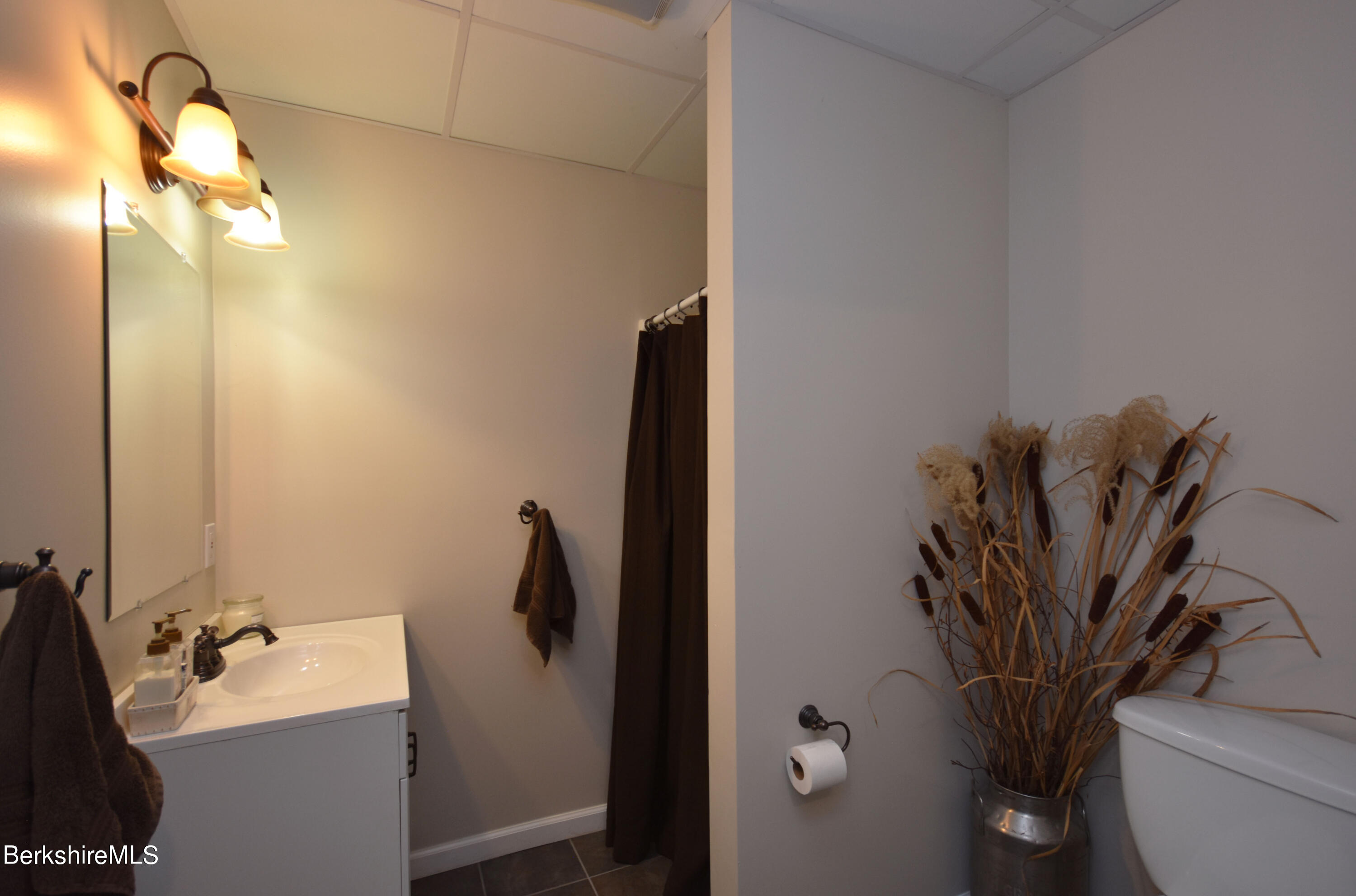 1540 East Windsor Road Windsor, MA 01270 - Photo 34 of 52 a bathroom with a sink a toilet and a mirror