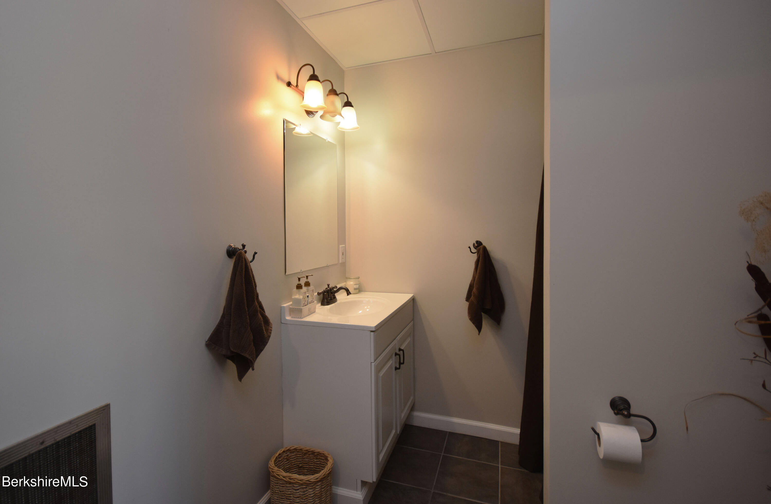 1540 East Windsor Road Windsor, MA 01270 - Photo 35 of 52 a bathroom with a sink and mirror