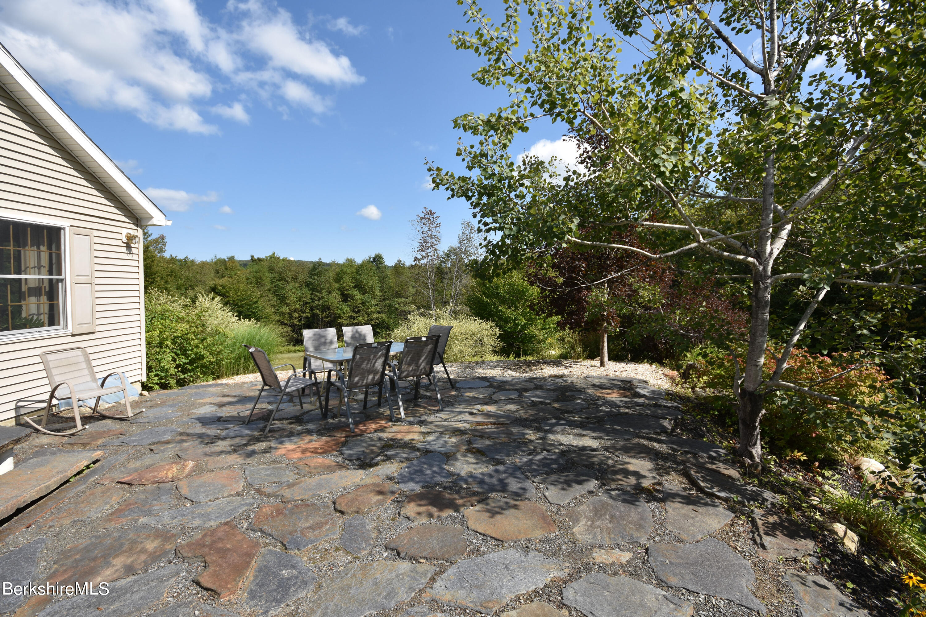 1540 East Windsor Road Windsor, MA 01270 - Photo 42 of 52 a view of a tables and chairs in the patio