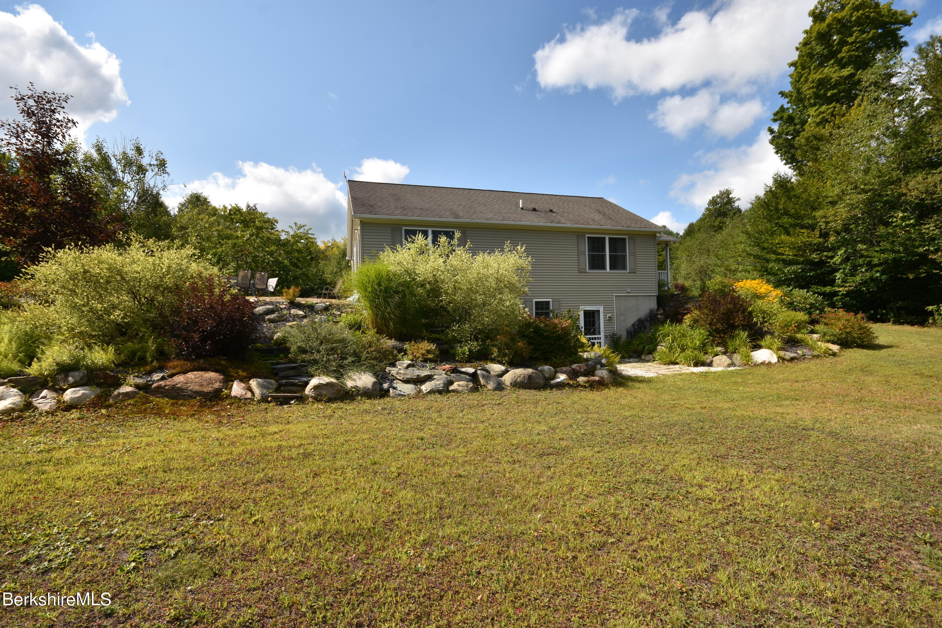 1540 East Windsor Road Windsor, MA 01270 - Photo 47 of 52 a view of a house with a yard
