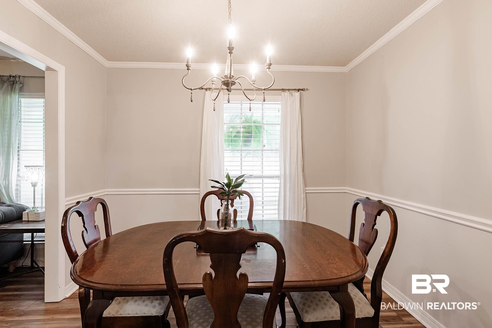 2920 Quail Creek Run Mobile, AL 36695 - Photo 17 of 33 Dining space featuring a chandelier, wood finished floors, and crown molding