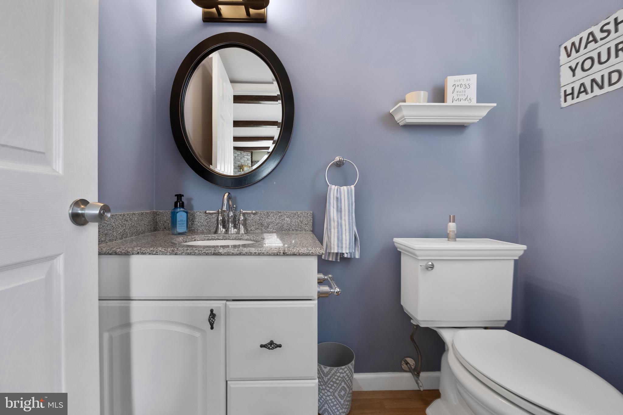 19 Draco Drive Sewell, NJ 08080 - Photo 17 of 34 a bathroom with a toilet a sink and a mirror