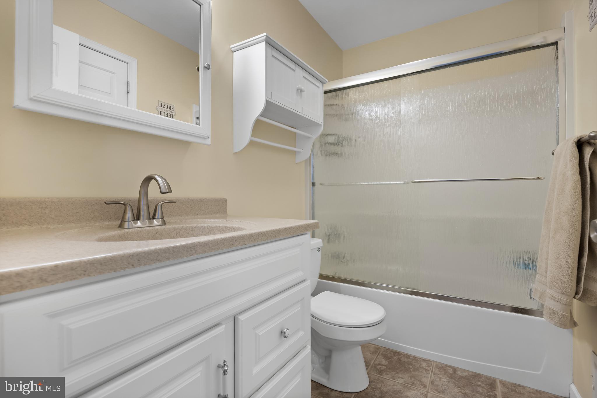 19 Draco Drive Sewell, NJ 08080 - Photo 29 of 34 a bathroom with a sink a toilet and shower