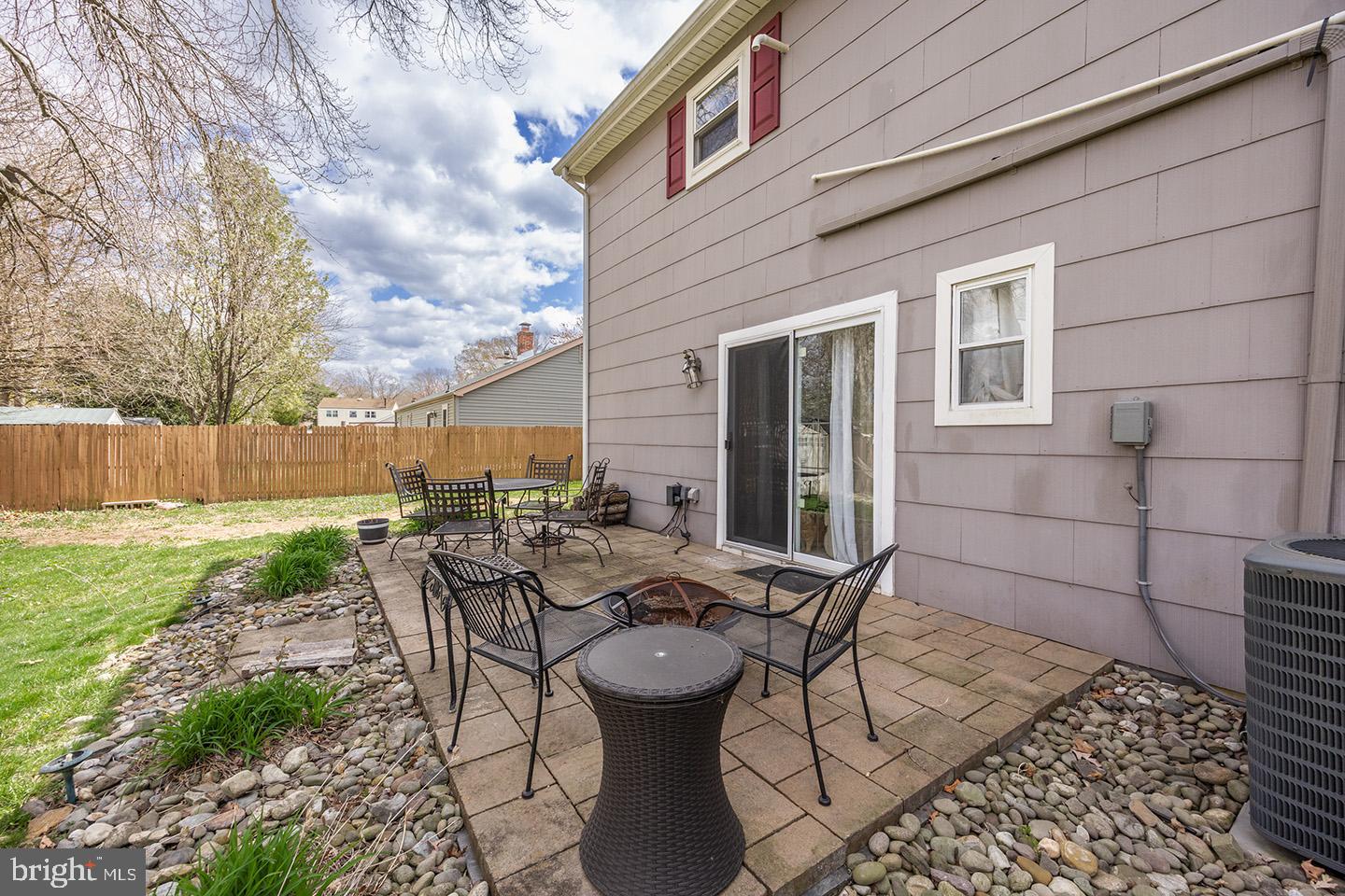 19 Draco Drive Sewell, NJ 08080 - Photo 31 of 34 a view of a patio with table and chairs and potted plants