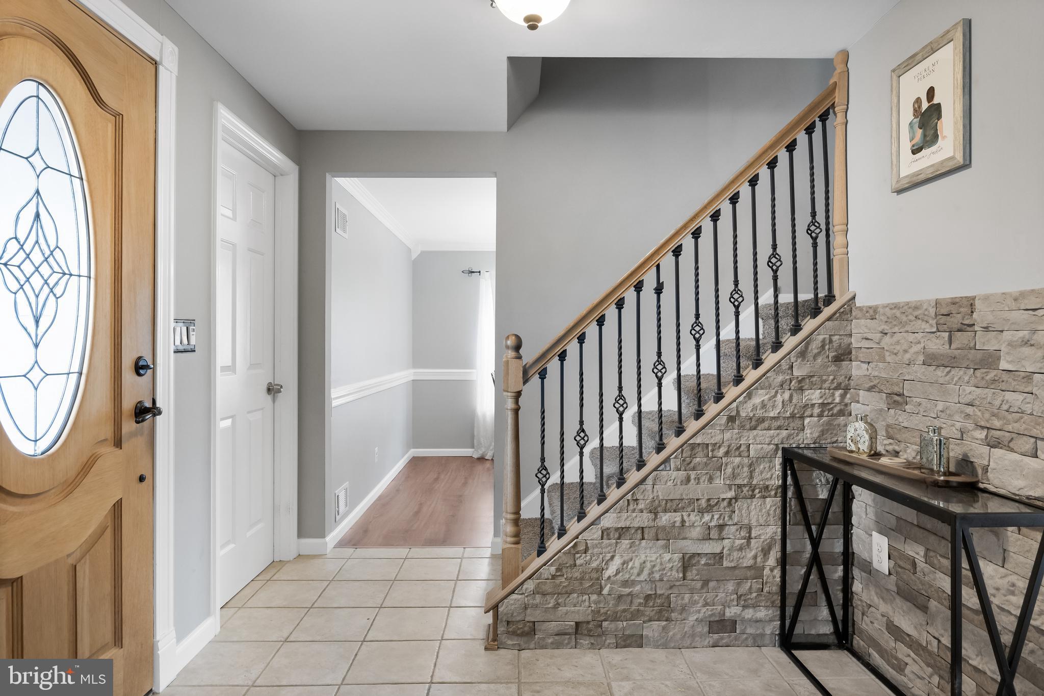 19 Draco Drive Sewell, NJ 08080 - Photo 4 of 34 a view of a hallway with wooden floor and entryway