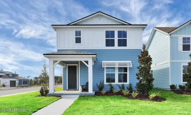 front view of a house with a yard