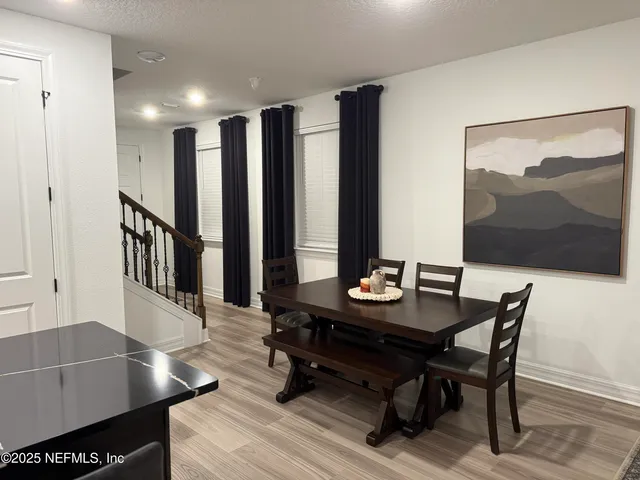 a view of a living room and dining room