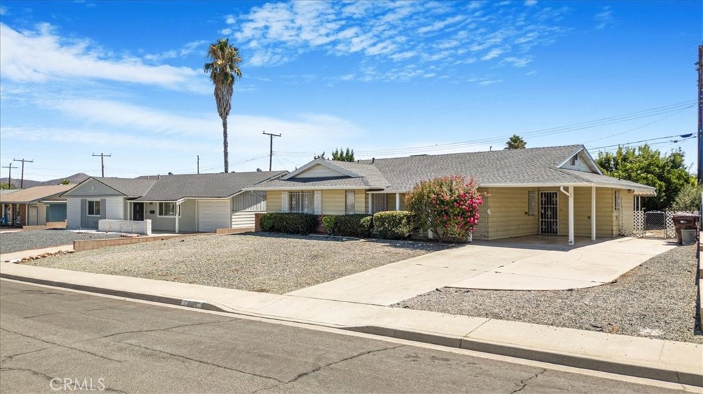 28258 West Worcester Road Menifee, CA 92586 - Photo 1 of 1 a front view of a house with a garden
