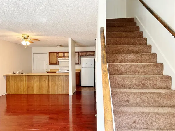 a view of an entryway with wooden floor