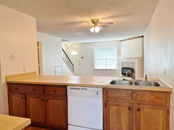 a kitchen with a sink and cabinets