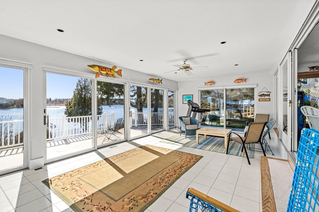 62 Crafts Road Gloucester, MA 01930 - Photo 11 of 40 a living room with lots of furniture and a table
