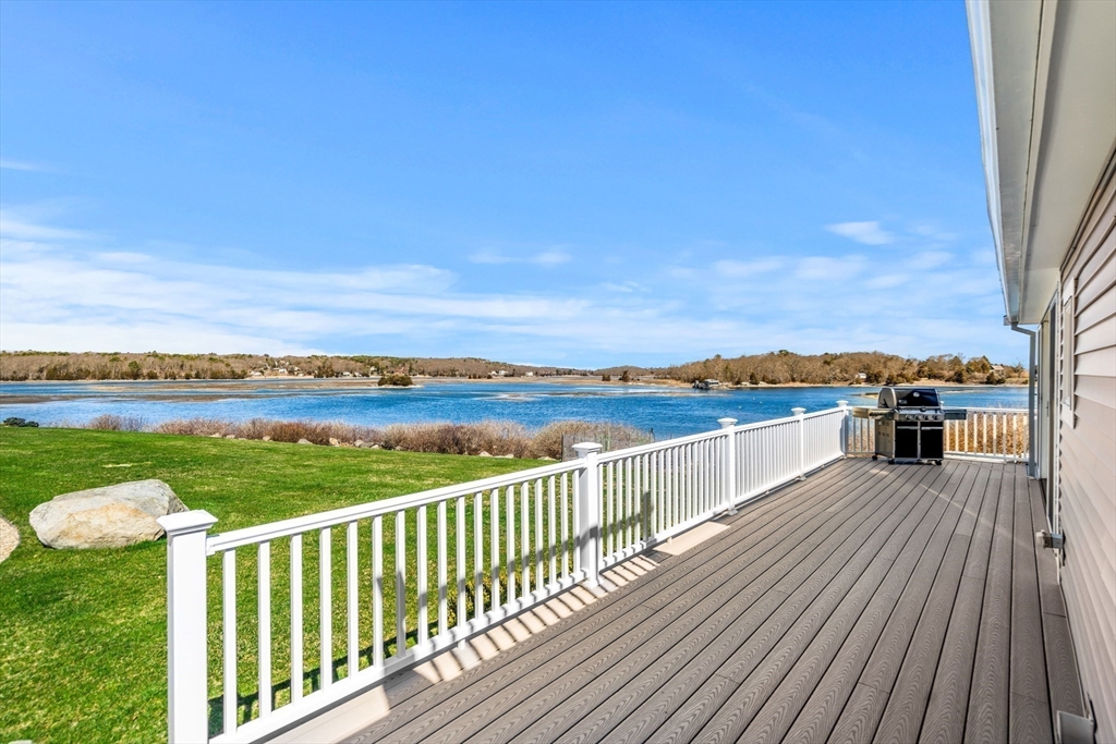 62 Crafts Road Gloucester, MA 01930 - Photo 18 of 40 a view of a balcony with wooden floor & fence