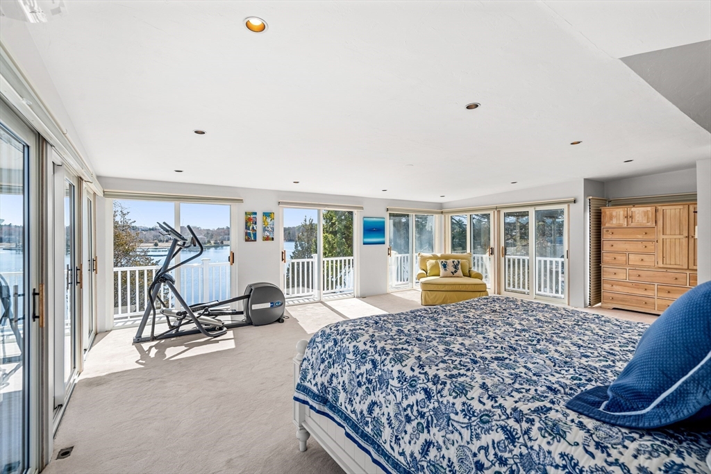 62 Crafts Road Gloucester, MA 01930 - Photo 21 of 40 a bedroom with furniture and large windows