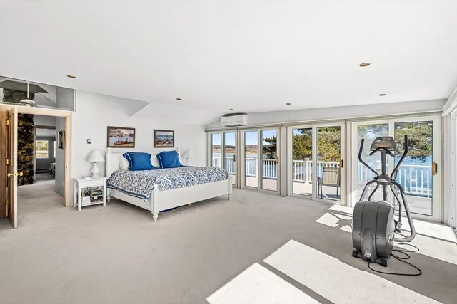 a bedroom with a bed and a night stand