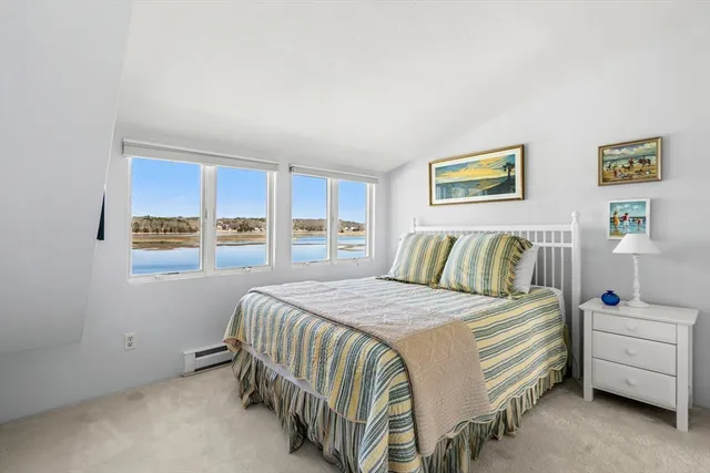 a living room with patio furniture and a table