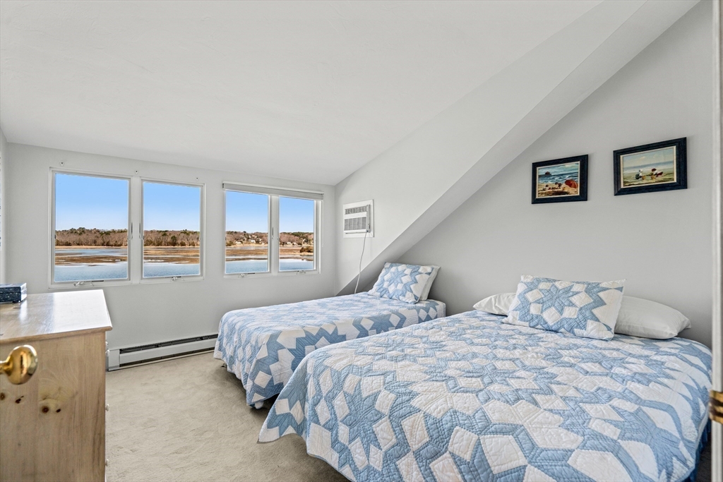 62 Crafts Road Gloucester, MA 01930 - Photo 25 of 40 a bedroom with a large bed and a window