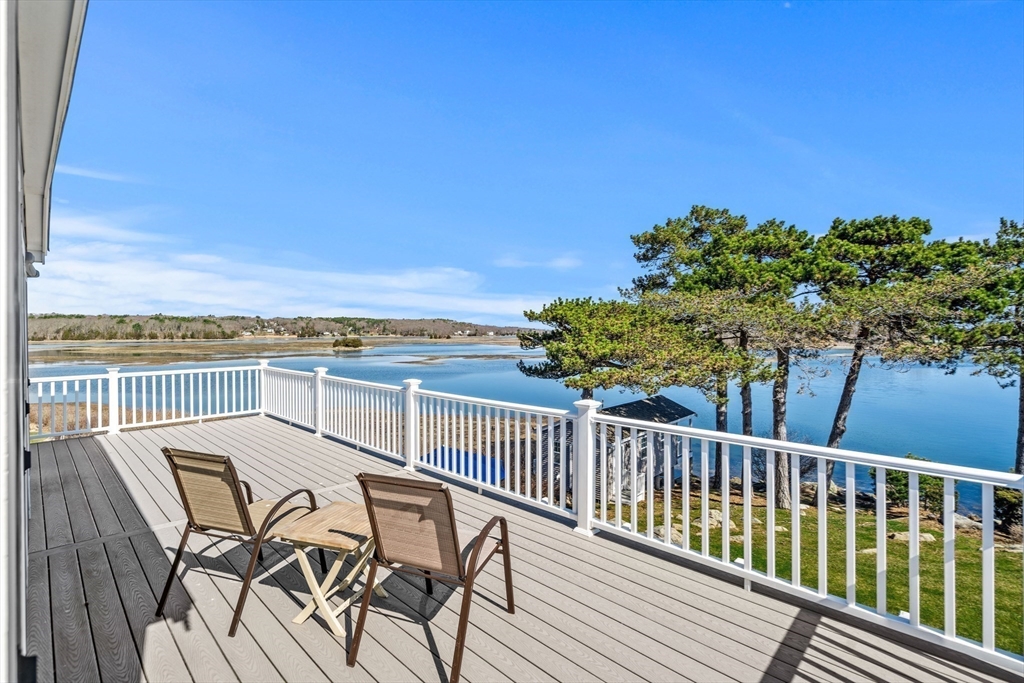 62 Crafts Road Gloucester, MA 01930 - Photo 26 of 40 a view of a chairs and table on the terrace