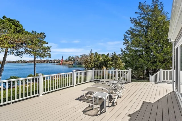 a view of a house with backyard outdoor seating area and furniture