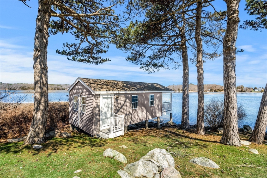 62 Crafts Road Gloucester, MA 01930 - Photo 29 of 40 a view of a house with backyard outdoor seating area and furniture