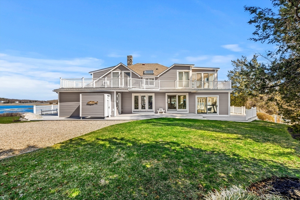 62 Crafts Road Gloucester, MA 01930 - Photo 35 of 40 a front view of a house with a garden and yard