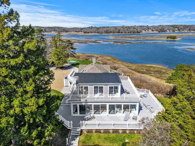 an aerial view of a house with lake view