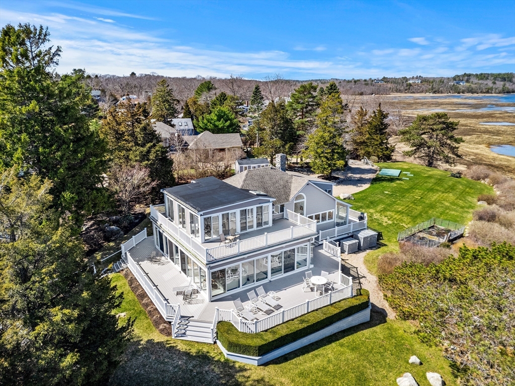 62 Crafts Road Gloucester, MA 01930 - Photo 38 of 40 a view of a lake with building in front of it