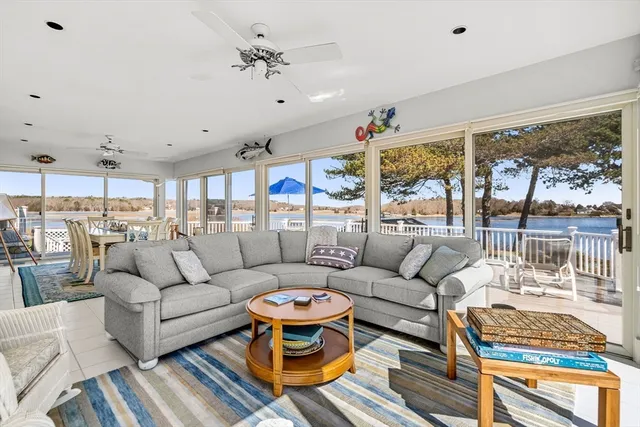 a living room with lots of furniture and a table