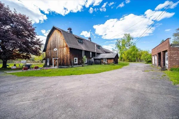 a view of an house with backyard space and garden