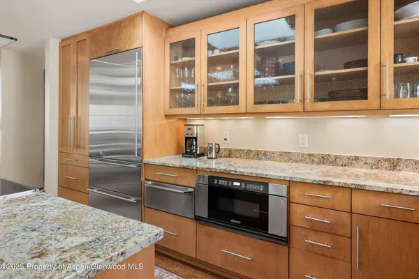 a kitchen with a stove and a sink