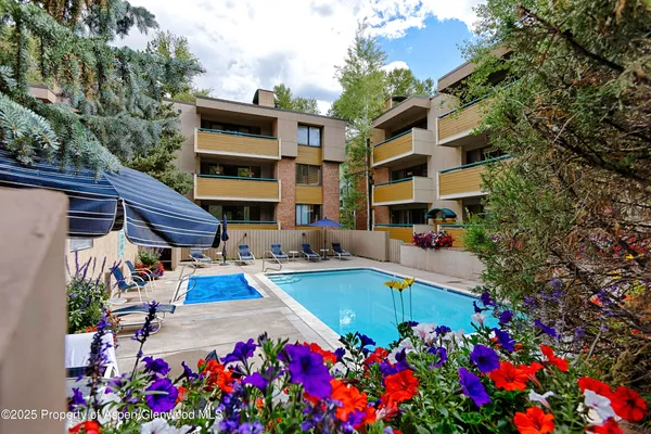 a view of a house with swimming pool