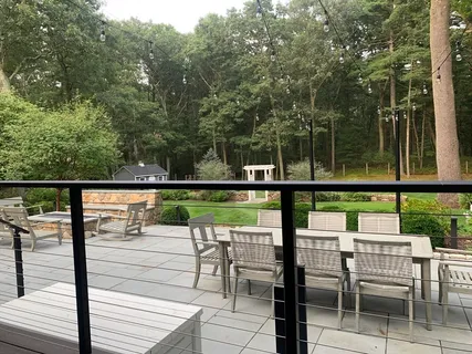 a view of a chairs and table on the deck