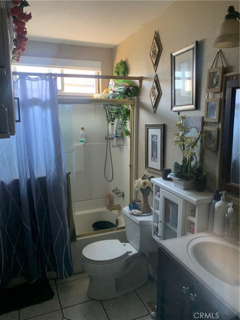 22414 Horst Avenue Hawaiian Gardens, CA 90716 - Photo 2 of 11 a bathroom with a sink a toilet and shower