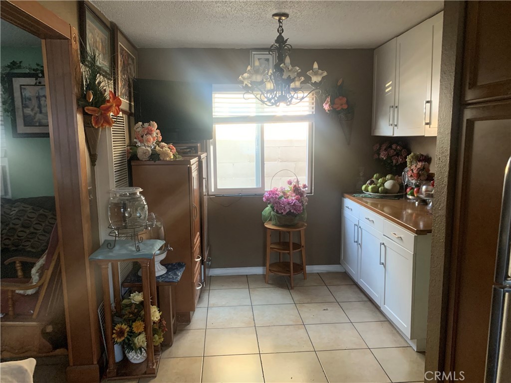 22414 Horst Avenue Hawaiian Gardens, CA 90716 - Photo 4 of 11 a kitchen with refrigerator and cabinets