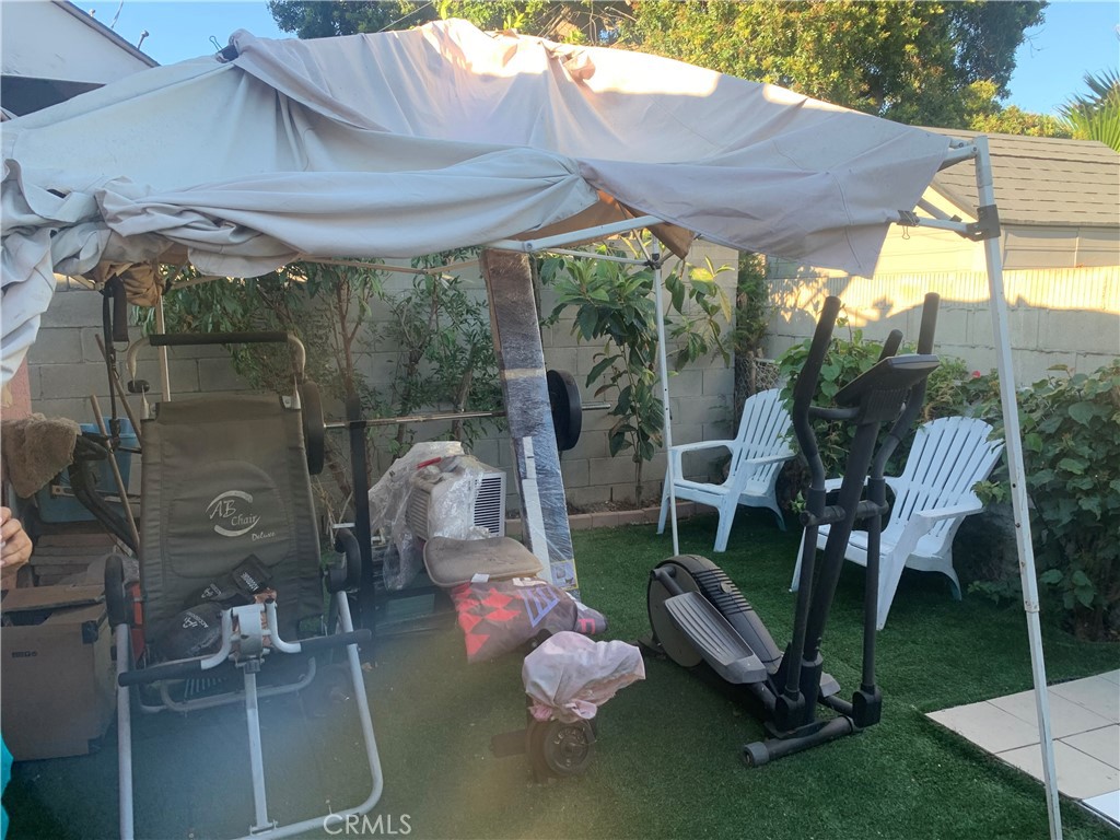 22414 Horst Avenue Hawaiian Gardens, CA 90716 - Photo 10 of 11 a patio with table and chairs and potted plants