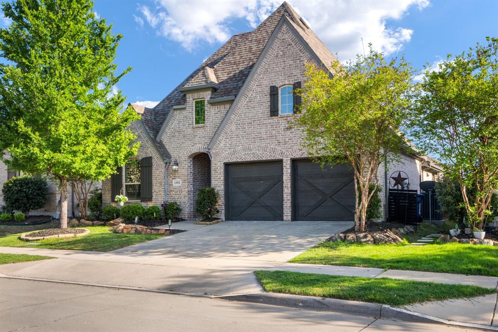 1501 Snowdrop Drive Prosper, TX 75078 - Photo 19 of 27 a front view of a house with a yard and garage