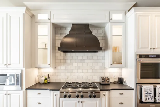 a bedroom with a bed and a fireplace